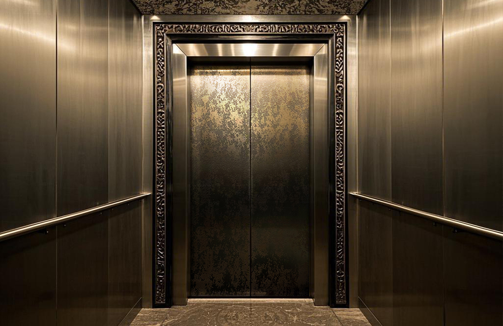 Etched antique stainless steel elevator room