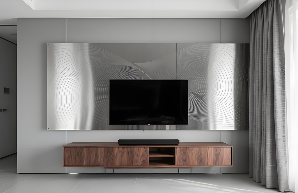 The TV background wall in the living room is made of matte Decorative stainless steel sheet, with the surface etched with "gravitational wave" radial pattern and suspended walnut TV cabinet